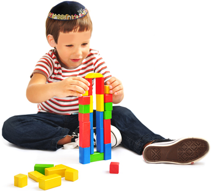 boy-playing-with-blocks-on-floor
